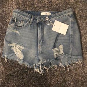 BRAND NEW distressed denim shorts from Vici!